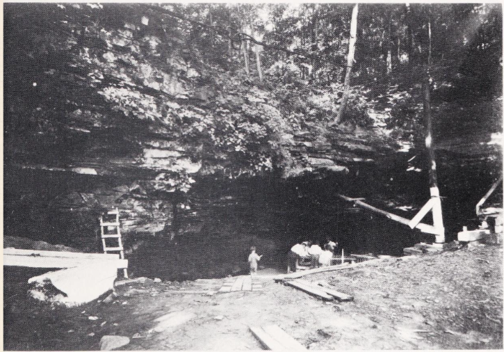 1925 photograph of Sand Cave entrance, with several men